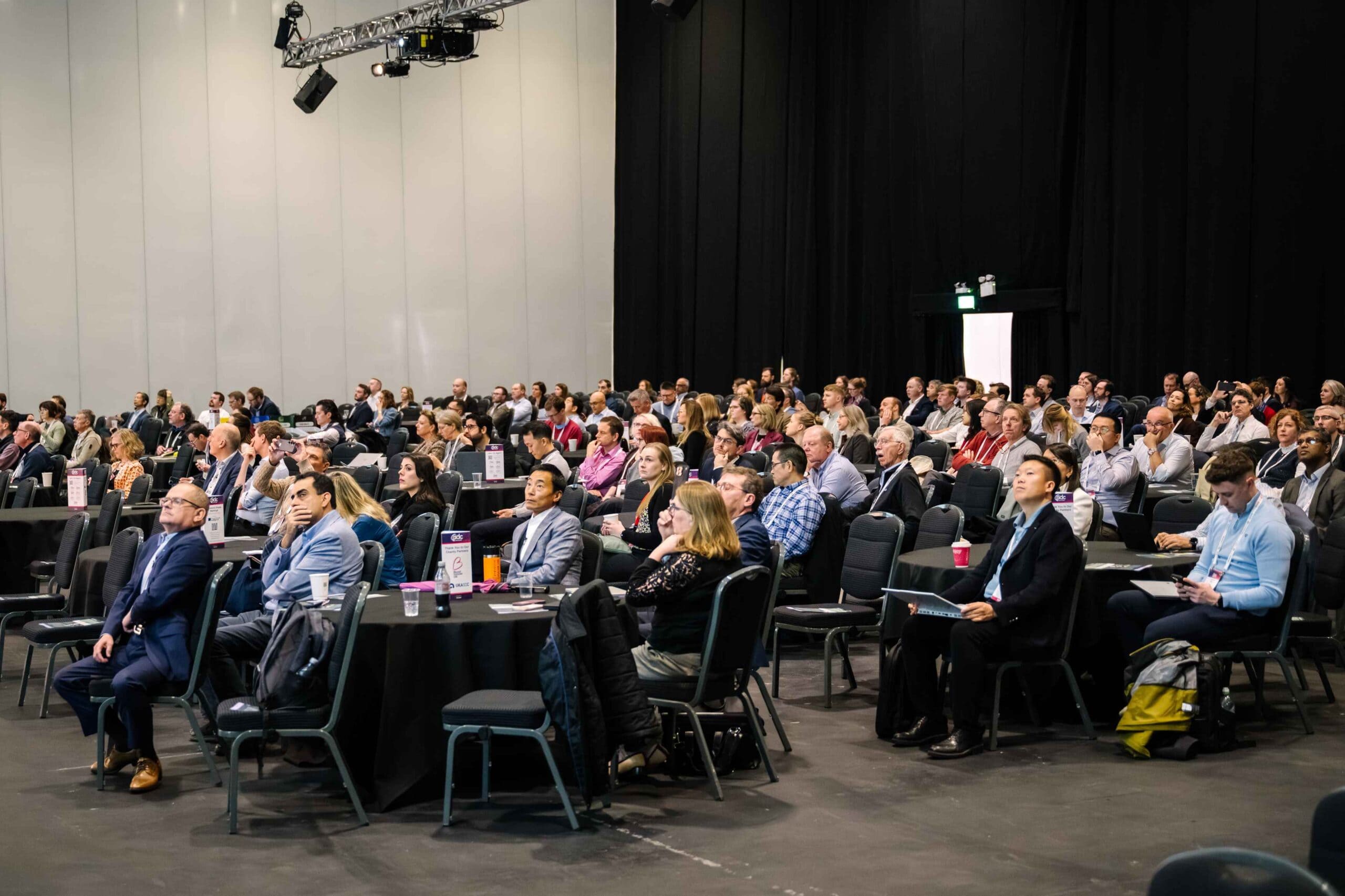 Conference attendees participating in a scientific presentation session at World ADC London.